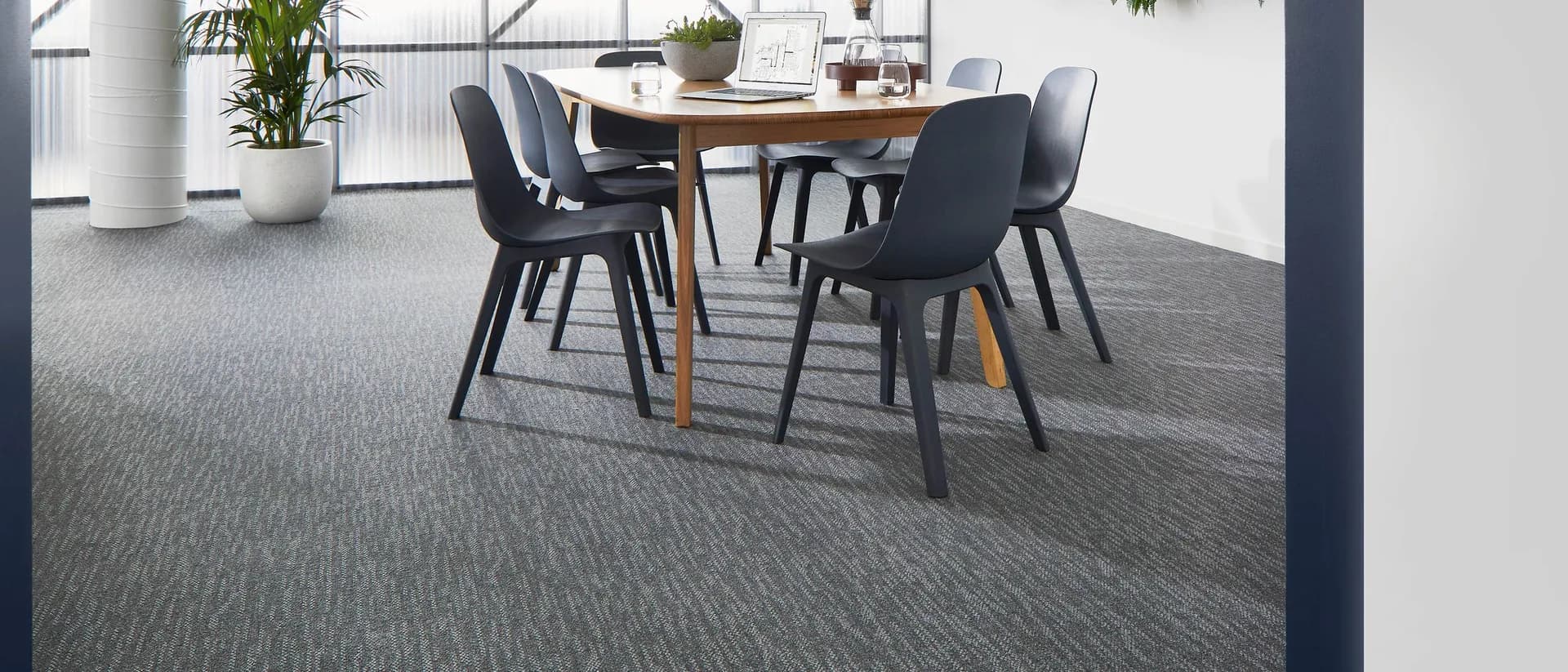 Forge Ahead — commercial office meeting room, timber table, black chairs