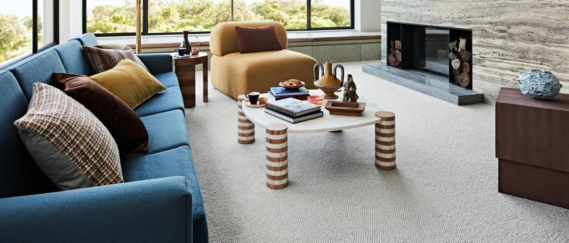 Vintage Grace — open living room, blue sofa, fireplace, textured wool