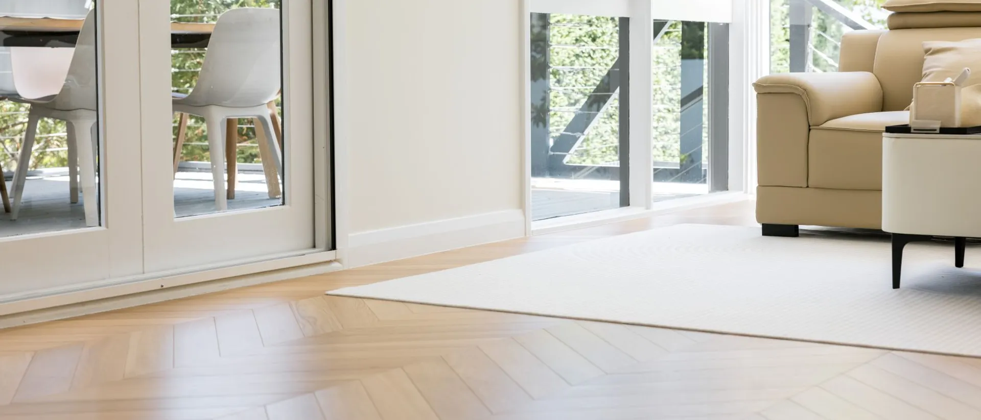 European Oak Collection — Chevron — living room with rug, clear oak chevron floor
