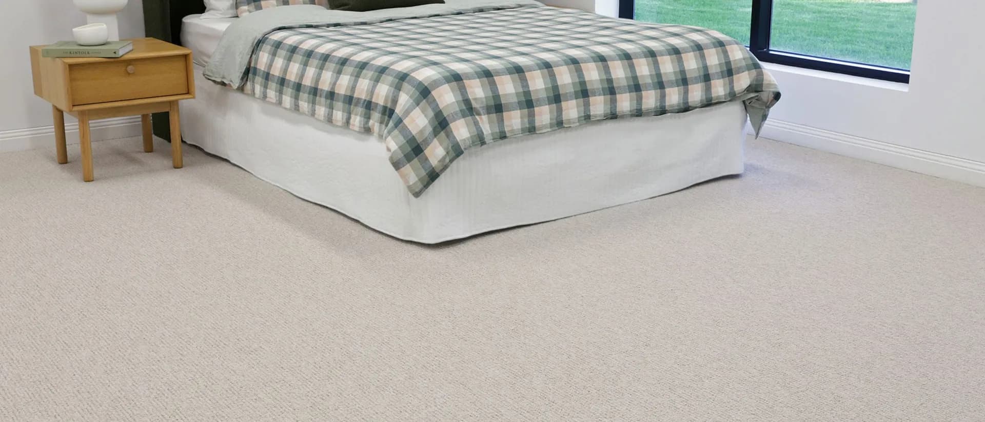 Ayrton — bedroom, checked bedding, timber nightstand, garden window