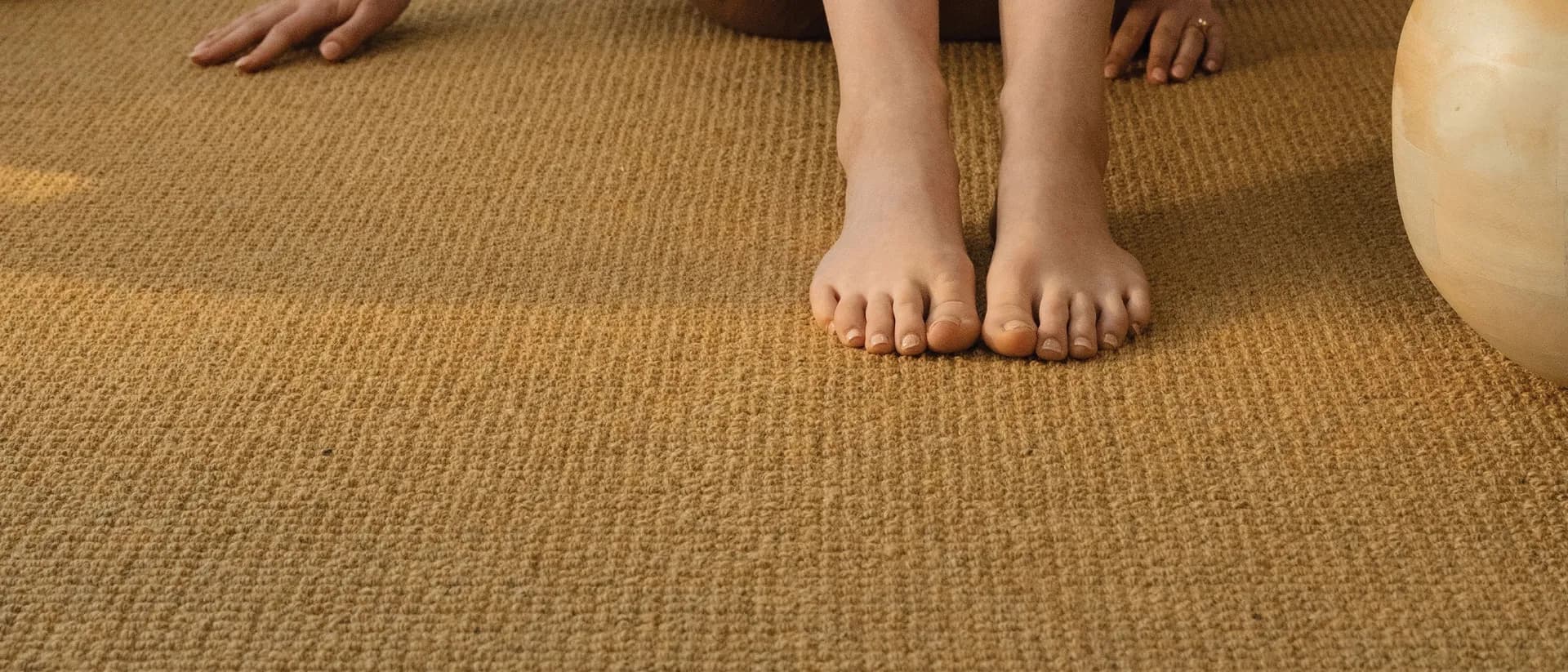 Bahamas — living room floor, rattan cushion, timber stool, plant