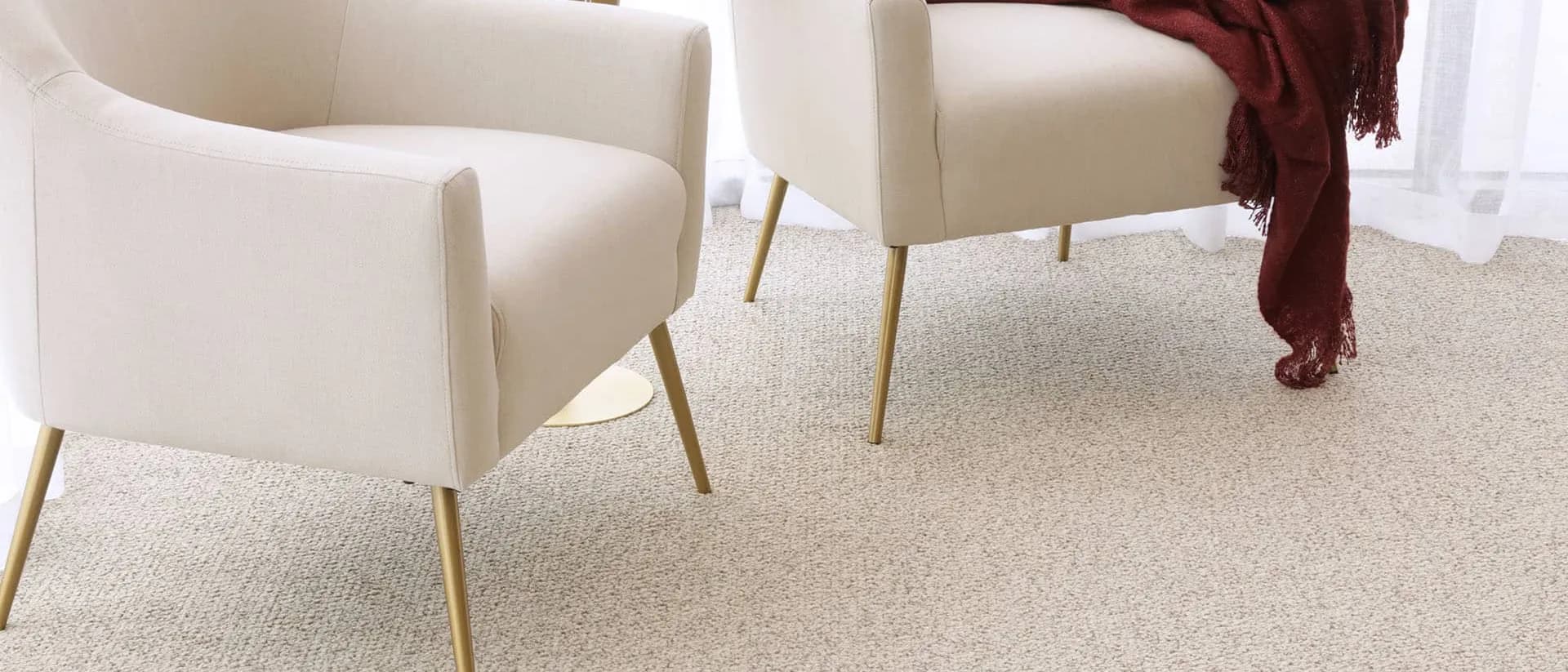 Bouclé — two cream armchairs, sheer curtains, textured loop carpet