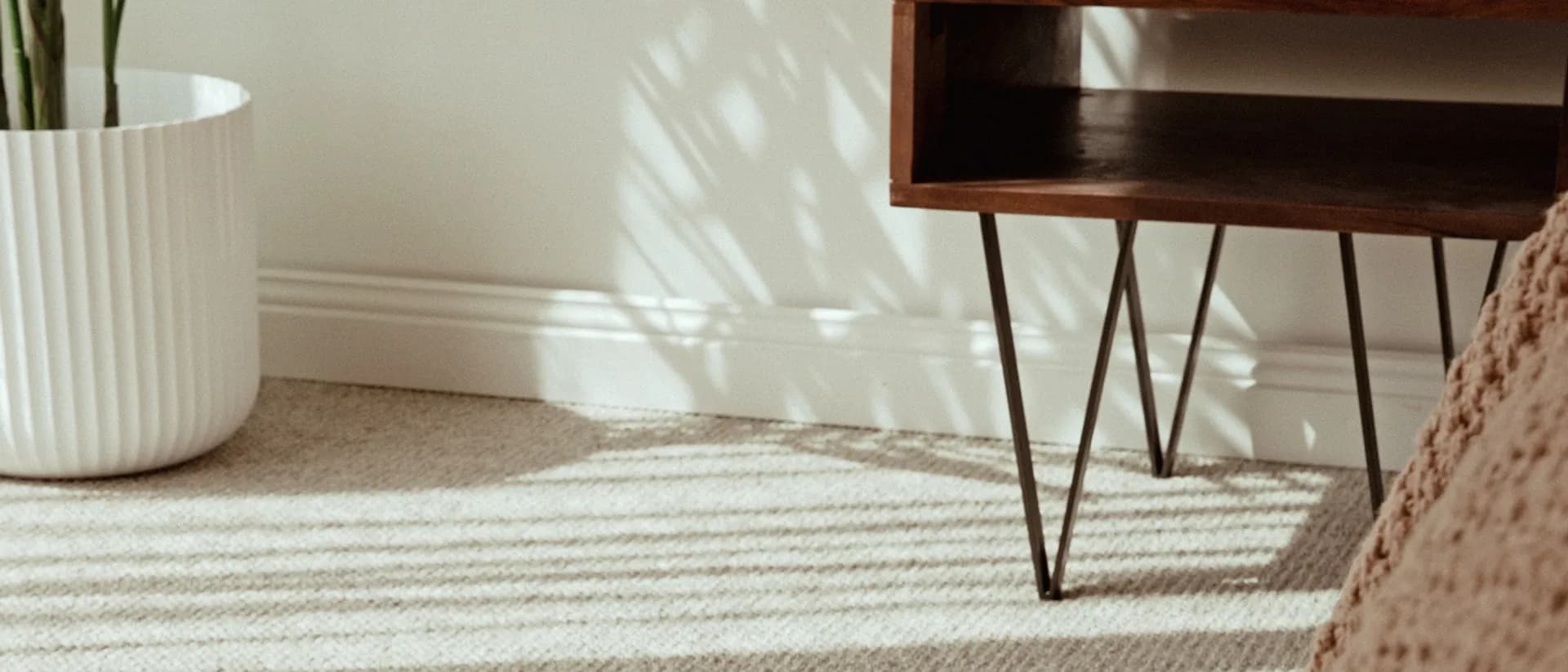 Dawson Falls — bedroom corner, hairpin bedside table, dappled light