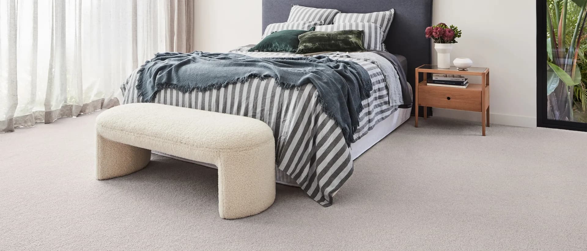 Elysian — bedroom, striped bedding, sheer curtains, pale grey carpet