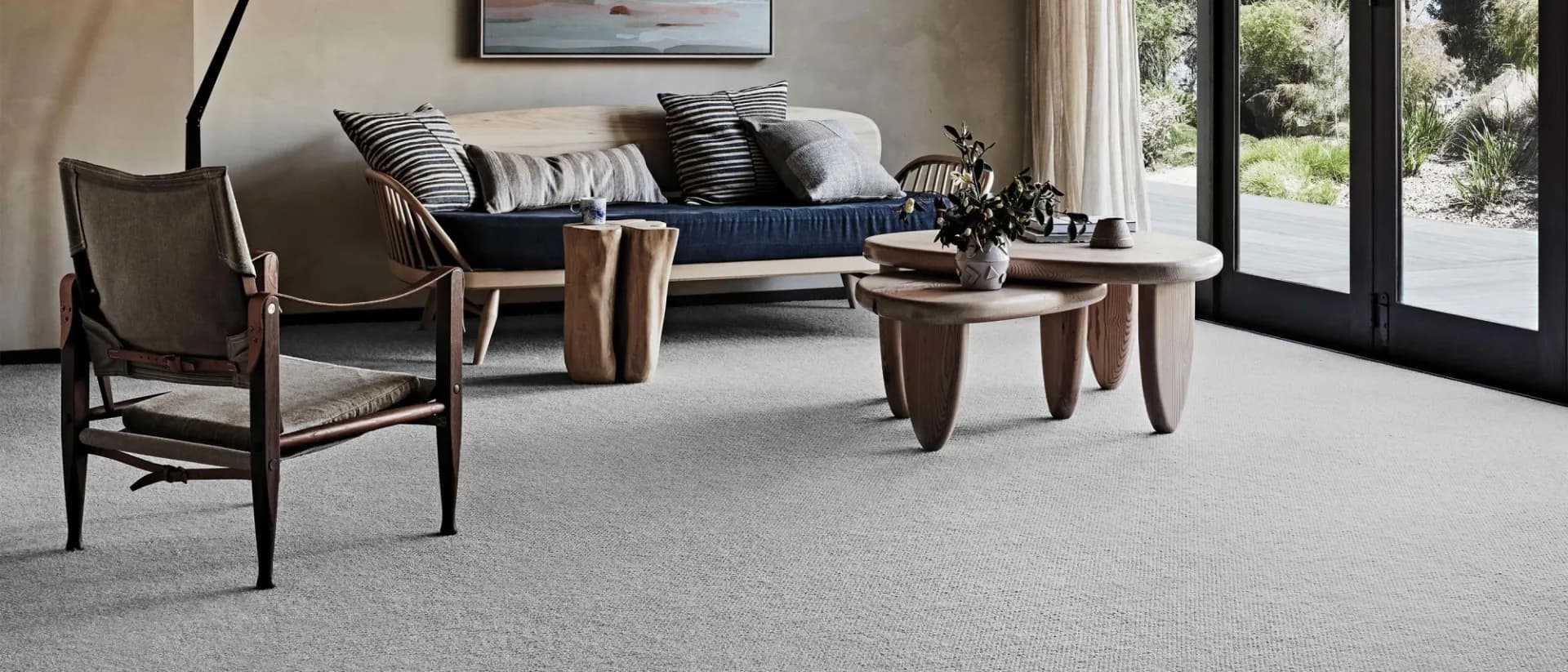 Chatsworth — living room, navy sofa, glass doors, grey loop wool