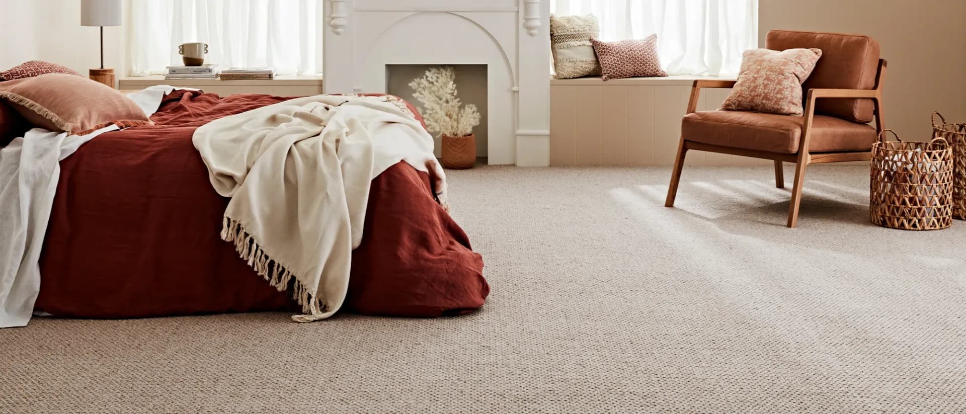 Montrose — bedroom with fireplace, red bedding, oatmeal looped wool