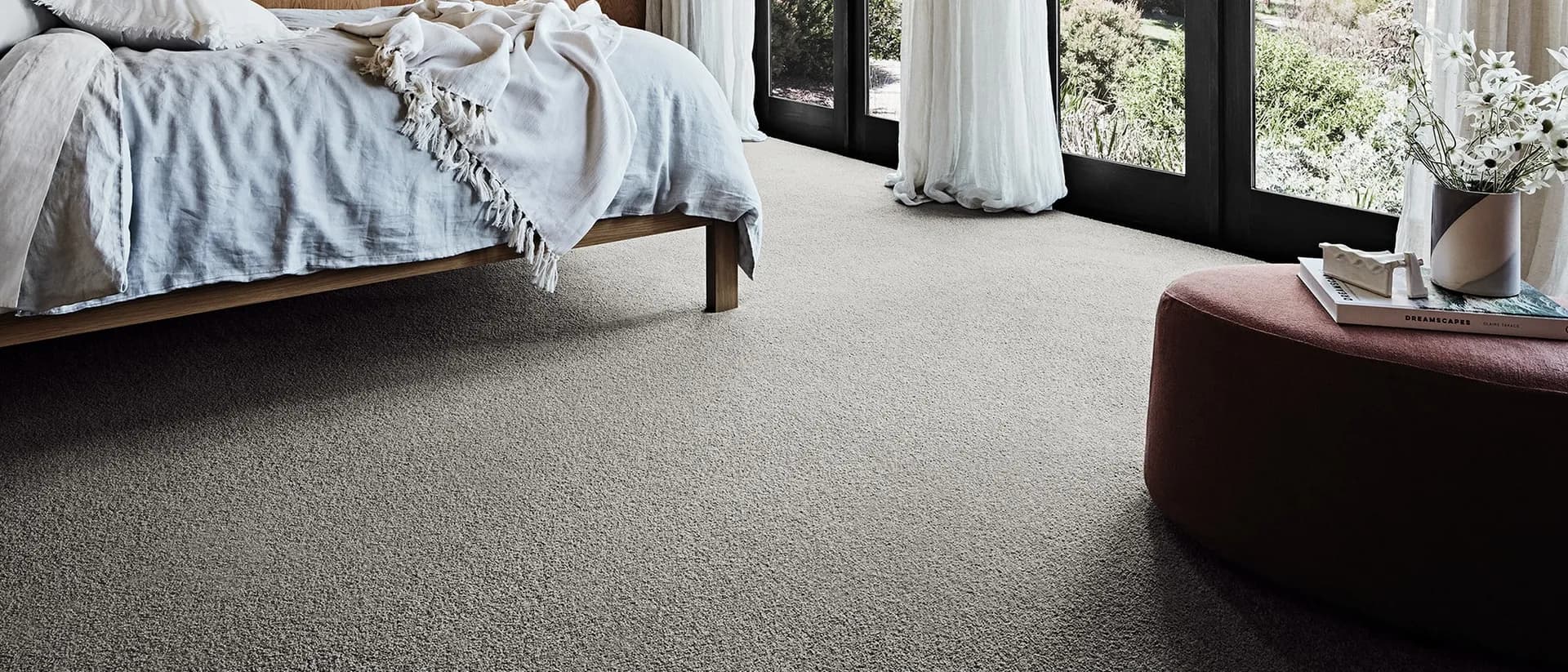 Queenstwist — bedroom with floor-to-ceiling windows, grey twist carpet