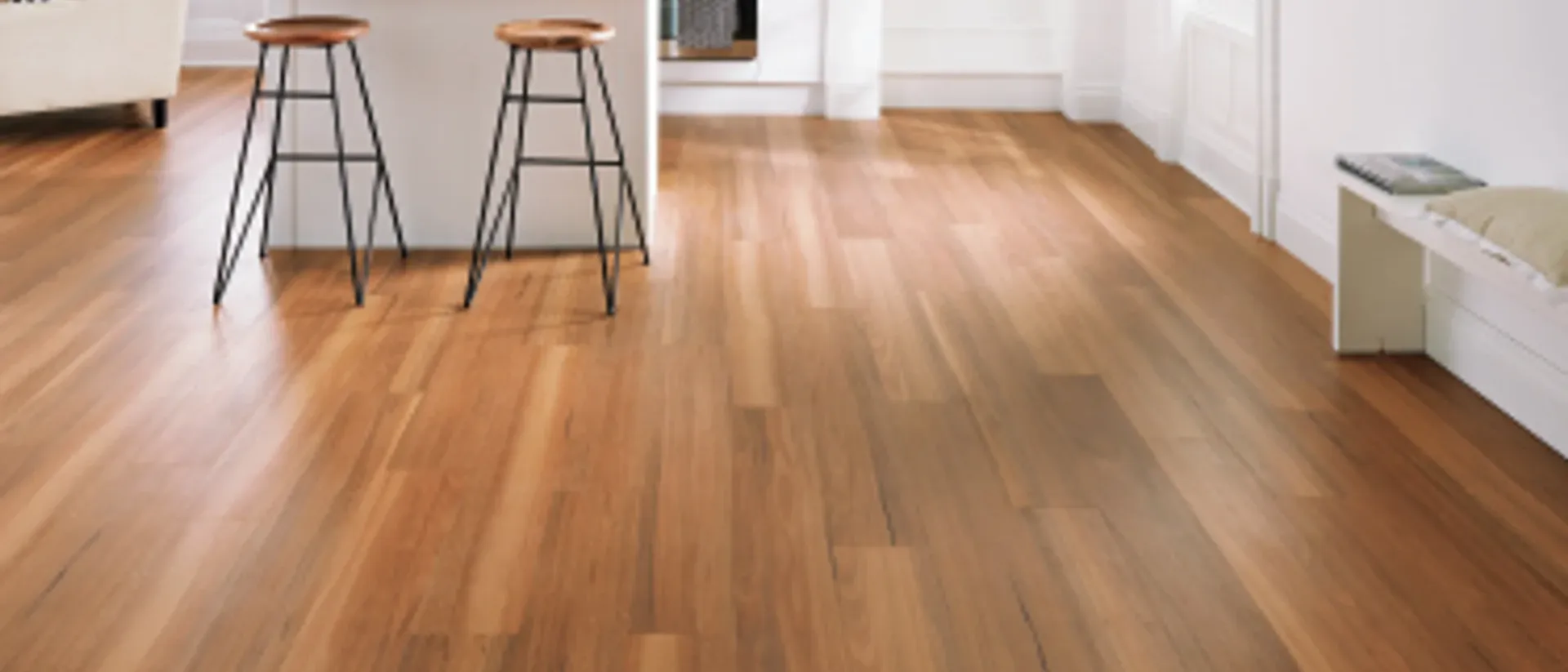 Van Gogh Rigid Core — open-plan kitchen, stools, northern spotted gum planks