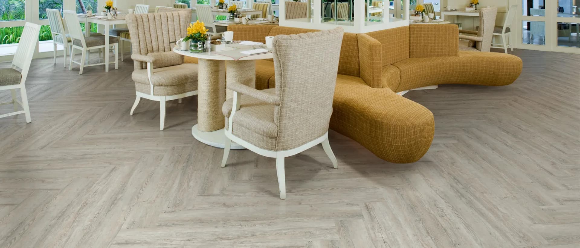 Affinity PUR — bright dining lounge, grey herringbone floor, garden views
