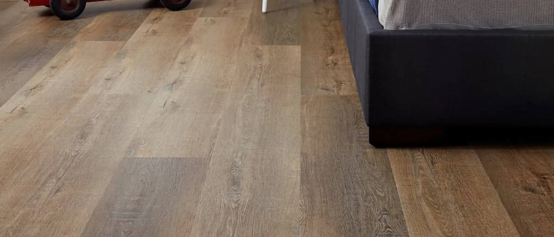 Aspire RCB — child's bedroom, wide grey-oak plank floor