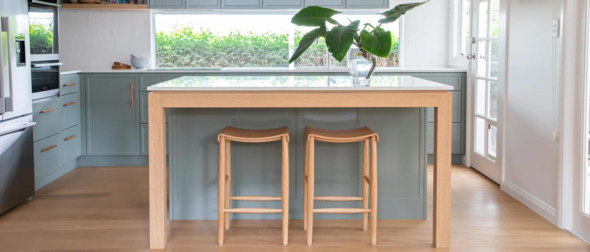 Hardwood Collection — green island kitchen, warm oak plank floor