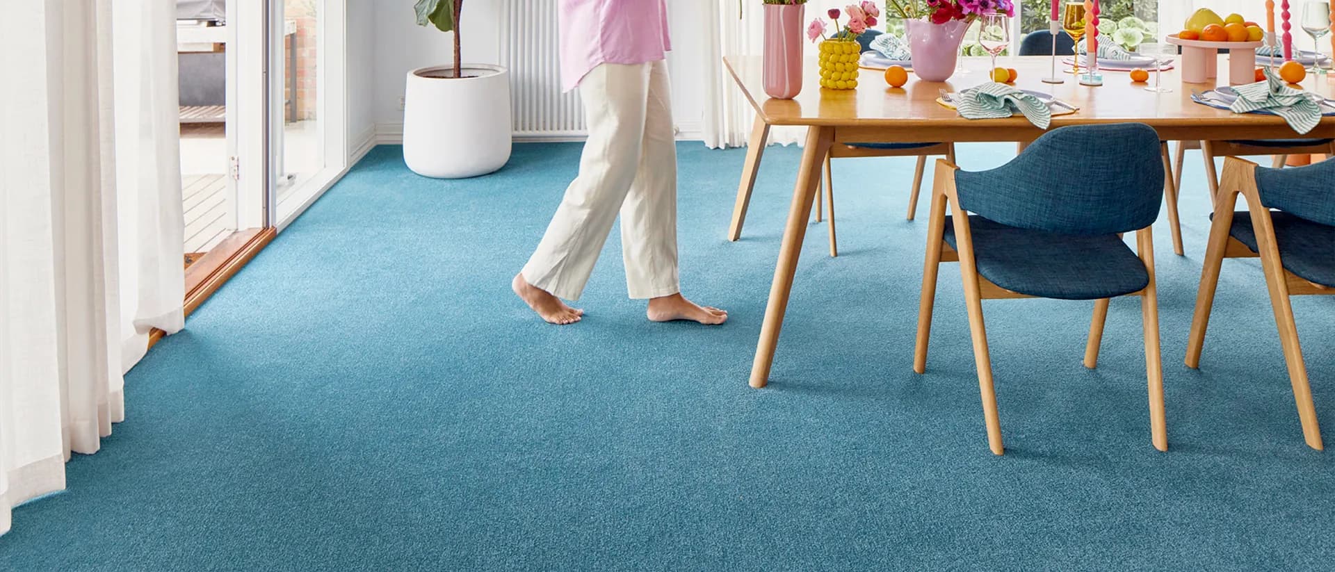 Dawn Rise — dining room with blue carpet and set table