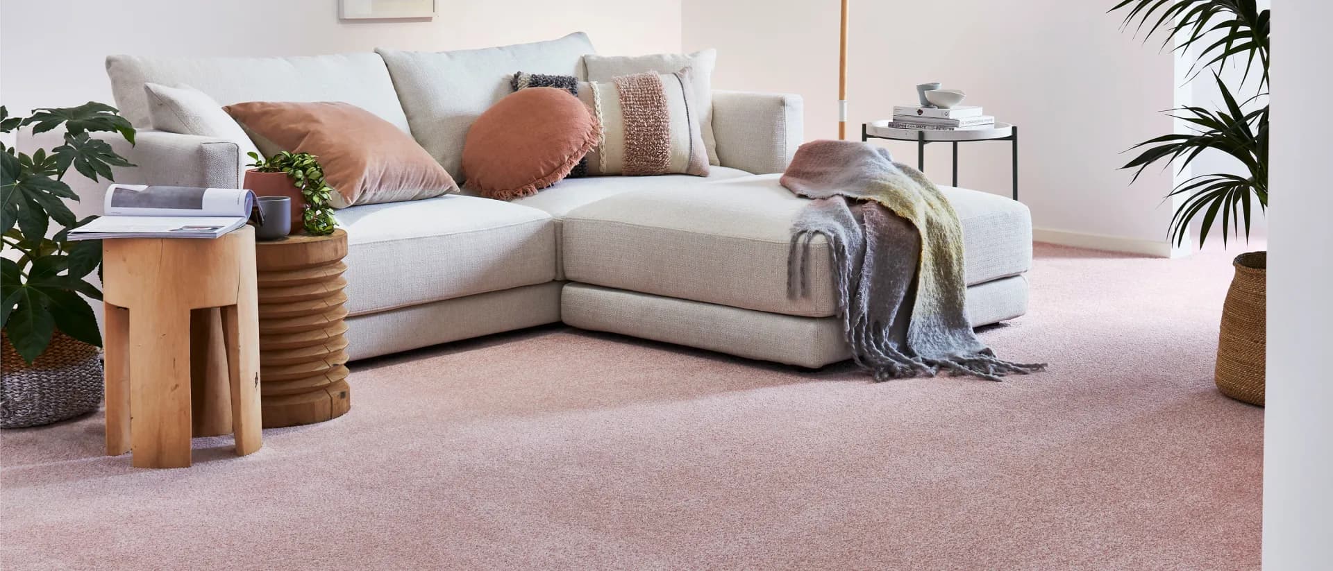 Freedom — living room, cream sectional sofa, blush pink carpet