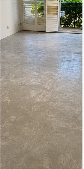 The same slab ground back clean and even, ready for levelling compound.