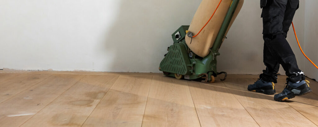 person operating floor polishing machine